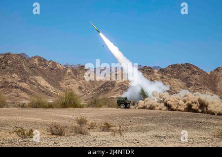 California, USA. 13th Apr, 2022. U.S. Marines assigned to Kilo Battery, 2nd Battalion, 14th Marine Regiment, 4th Marine Division, fire an M142 High Mobility Artillery Rocket System (HIMARS), during Weapons and Tactics Instructor (WTI) Course 2-22, near Chocolate Mountain Aerial Gunnery Range, California, April 13, 2022. WTI is a seven-week training event hosted by Marine Aviation Weapons and Tactics Squadron One, providing standardized advanced tactical training and certification of unit instructor qualifications to support Marine aviation training and readiness, and assists in developing an Stock Photo