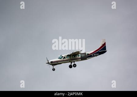 Cessna 208b Grand Caravan G-BZAH light aircraft descending to land Stock Photo