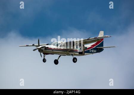 Cessna 208b Grand Caravan G-BZAH light aircraft descending to land Stock Photo