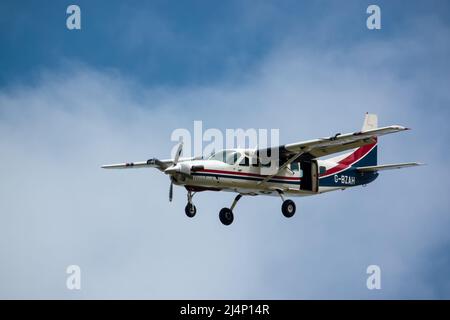 Cessna 208b Grand Caravan G-BZAH light aircraft descending to land Stock Photo