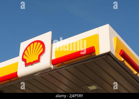 A colourful Shell logo and branding on a garage forecourt in Roehampton, London, England, UK Stock Photo