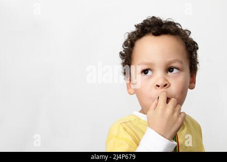 child looking to the side with background with people stock photo Stock Photo