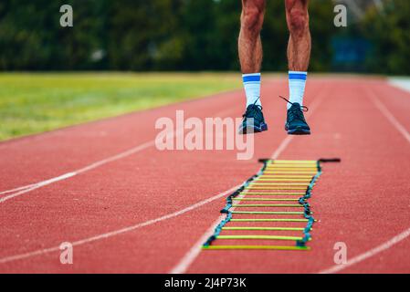 Legs of a man, a runner in the air jumping. Morning workout, illustrative sports shot Stock Photo