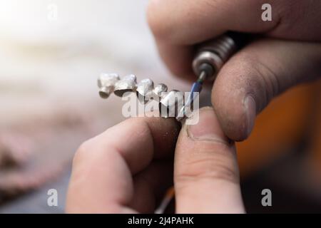 Dental prosthesis, dentures, prosthetics work. A study and a table with dental tools Stock Photo