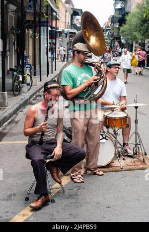 New Orleans, Louisiana, United States - July 17 2009: Jazz Band with Sousaphone, Clarinet, and Drums Playing Outdoors on Bourbon Street. Stock Photo