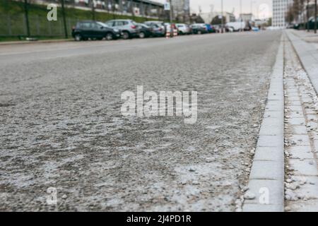 Asphalt pavement of the highway. The coating is not new, gradually collapsing. Stock Photo