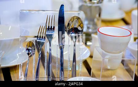 Table set: fork, spoon, knife and cup Stock Photo