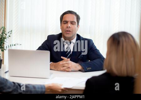 Executive or boss angry and complaining employee with work failure at meeting room in the office, manager or entrepreneur furious and annoyed staff wi Stock Photo