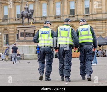 Glasgow, Scotland, UK 17th April, 2022, Heavy police presence in george square ahead of the celtic rangers clash in case of disorder and with the memory of last years trashing of the square by rangers fans, it has newly been relaid in the turf areas of the square as per my previous pictures.. Credit Gerard Ferry/Alamy Live News Stock Photo