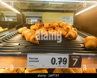 Sausage croissants for sale in a Lidl store. Stock Photo