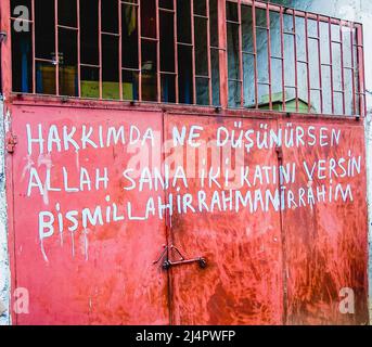 Writing on a barn door in a Turkish farm which roughly translates to 'What we pray for, may God gave us twice' praying for a good harvest. Stock Photo