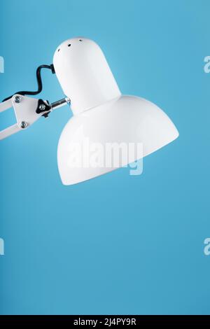 Office table lamp on blue background with space for text and idea concept Stock Photo