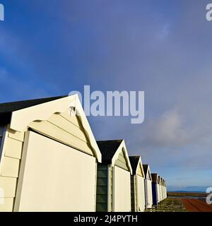 Row of closed beach huts in winter Stock Photo