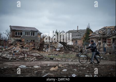Ukraine. 16th Apr, 2022. A man walks his bike in a residential area of Chernihiv, Ukraine damaged by shelling during the Russian invasion on April 16, 2022. Russian military forces entered Ukraine territory on Feb. 24, 2022. (Photo by Piero Cruciatti/Sipa USA) Credit: Sipa USA/Alamy Live News Stock Photo