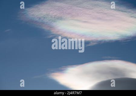 South Georgia, St. Andrew's Bay, Cloud iridescence or irisation aka rainbow clouds. Common ype of photometeor. Lenticular clouds. Stock Photo