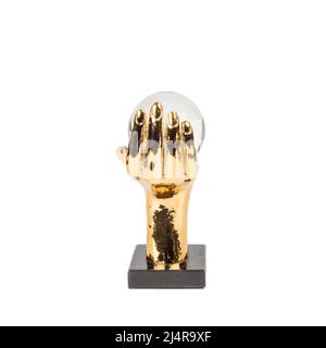 abstract metal hand with marble stand isolated on white luxury house decor Stock Photo