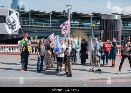 XR commits to taking over four bridges in London which include, Westminster, Lambeth, Waterloo & Blackfriars Bridge, and hold the front of Tate Modern Stock Photo