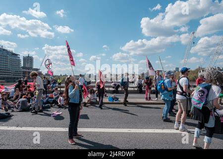 XR commits to taking over four bridges in London which include, Westminster, Lambeth, Waterloo & Blackfriars Bridge, and hold the front of Tate Modern Stock Photo