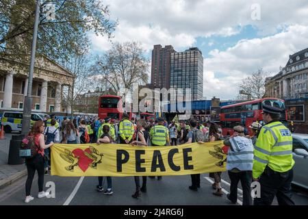 XR commits to taking over four bridges in London which include, Westminster, Lambeth, Waterloo & Blackfriars Bridge, and hold the front of Tate Modern Stock Photo