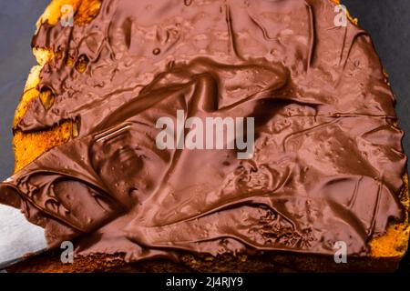 Spreading chocolate cream on toasted bread Stock Photo