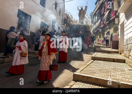 Almunecar, Spain. 17th April 2022. Easter Holy Week, Semana Santa,  in Almuñécar, declared of National Tourist Interest in Andalusia, fills the streets of the municipality with tradition and heartfelt devotion each year. This is the Easter Sunday procession the final day of Holy Week. It commemorates the Catholic festival of the Resurrection of Jesus Christ. brotherhoods organize the processions that go through the streets and squares carrying beautiful thrones adorned with flowers and religious images that are carried by the forks. Credit David Smith/Alamy Live News Stock Photo