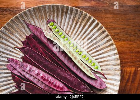 Pile of Guaje seed pods on a plate in Oaxaca, Mexico Stock Photo