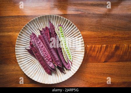 Pile of Guaje seed pods on a plate in Oaxaca, Mexico Stock Photo