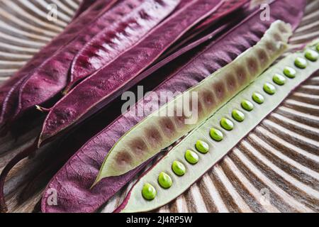 Pile of Guaje seed pods on a plate in Oaxaca, Mexico Stock Photo