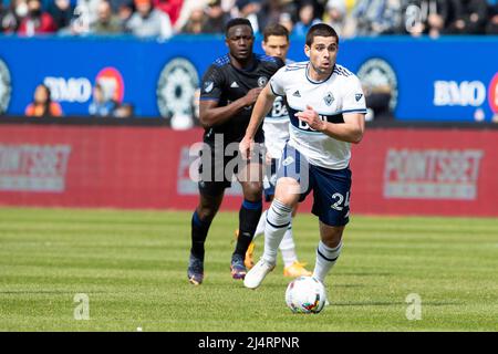 Montreal, Quebec. 16th Apr, 2022. Vancouver Whitecaps forward Brian White (24) runs with the ball during the MLS match between the Vancouver Whitecaps and CF Montreal held at Saputo Stadium in Montreal, Quebec. Daniel Lea/CSM/Alamy Live News Stock Photo