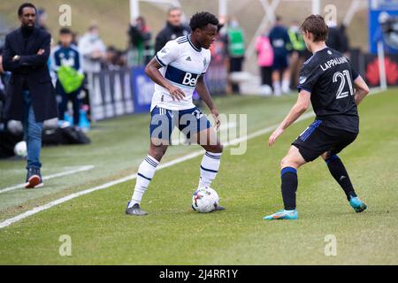 Montreal, Quebec. 16th Apr, 2022. Vancouver Whitecaps Javain Brown (23) controls the ball against CF Montreal Lassi Lappalainen (21) during the MLS match between the Vancouver Whitecaps and CF Montreal held at Saputo Stadium in Montreal, Quebec. Daniel Lea/CSM/Alamy Live News Stock Photo