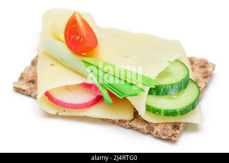 Whole Grain Crispbread with Cheese, Fresh Cucumber, Radish, Tomato and Green Onions - Isolated on White. Quick and Healthy Sandwiches. Crispbread with Tasty Filling. Healthy Dietary Snack - Isolation Stock Photo
