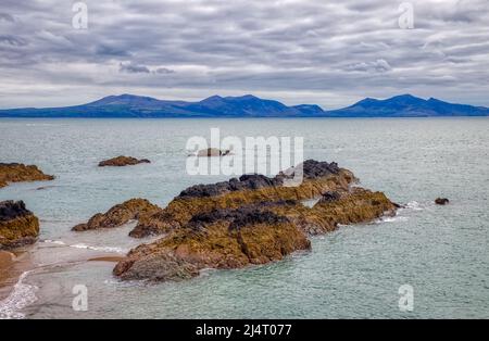 Rocks in Sea, Llanddwyn Island, Newborough, Anglesey, North Wales Stock Photo