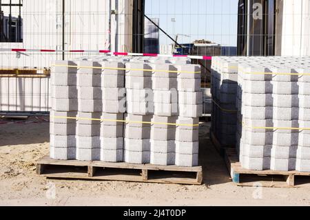 Grey stacked bricks on a construction site Stock Photo