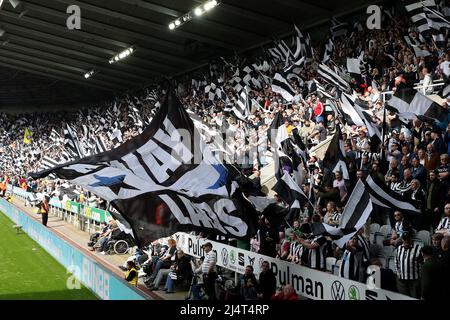 NEWCASTLE UPON TYNE, UK. Newcastle United's fans wave flags provided by supporters group 'Wor Flags' before the kick off the Premier League match between Newcastle United and Leicester City at St. James's Park, Newcastle on Sunday 17th April 2022. (Credit: Mark Fletcher | MI News) Credit: MI News & Sport /Alamy Live News Stock Photo