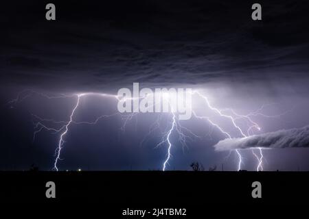 A powerful thunderstorm with intense lightning bolt strikes over Hobbs, New Mexico Stock Photo