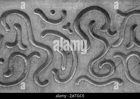 Abstract decorative pattern on the gray facade of the house Stock Photo