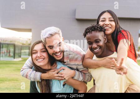 Diverse young people having fun together outdoor - Diversity lifestyle concept - Focus on gay man face Stock Photo