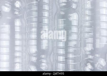 Empty transparent plastic bottle on white background. Top view. Pollution, recycling, environmental protection concept. Stock Photo