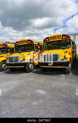 Rothsville, PA, USA - April 17, 2022: A close-up view of a parked yellow school bus in a rural village in Lancaster County, Pennsylvania. Stock Photo