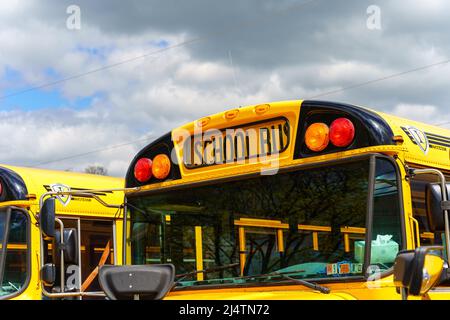 Rothsville, PA, USA - April 17, 2022: A close-up view of a parked yellow school bus in a rural village in Lancaster County, Pennsylvania. Stock Photo