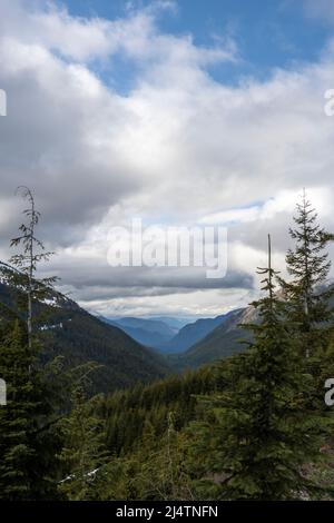 valley cut through the Cascade mountains northeast of Mount Rainier and looking into Rainier National Park Stock Photo