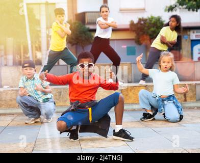 Kids training hip hop on city street Stock Photo - Alamy