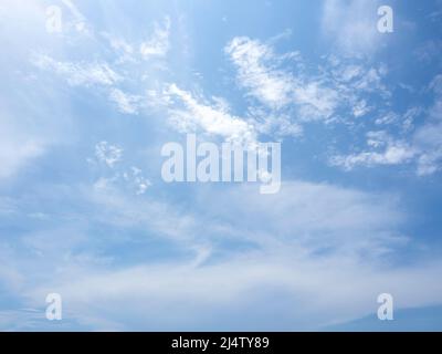 Blue sky background with white clouds. Summer bright clear sky. Stock Photo