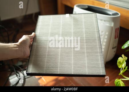 Air purifier filter in hand Stock Photo