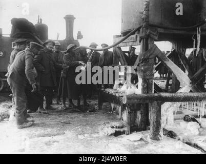 British troops with a light railway engine taking on water in Trones Wood, Somme, December 1916. Stock Photo