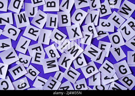 Letters and numbers on a purple trendy background as an idea for education and language learning information of typography and school fonts. Stock Photo