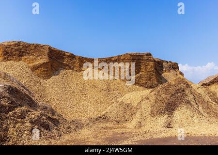 Wood chips at a storage place Stock Photo