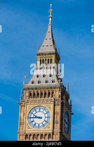 Upper detail of recently uncovered restored Elizabeth Tower, Big Ben, of the Palace of Westminster, London. Bright colours. Clock face and spire Stock Photo