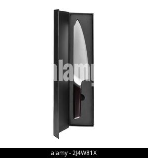 Carving knife with wooden handle in Black box isolated on white background. Knife for carving cooked meat into slices. Vertical shot. Stock Photo