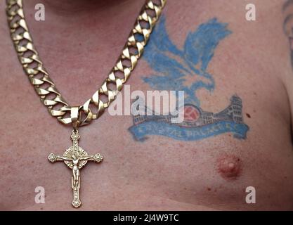 London, UK. 17th Apr, 2022. A Crystal Place fan wears a tattoo of the club crest on his chest during the Emirates FA Cup match at Wembley Stadium, London. Picture credit should read: Paul Terry/Sportimage Credit: Sportimage/Alamy Live News Stock Photo